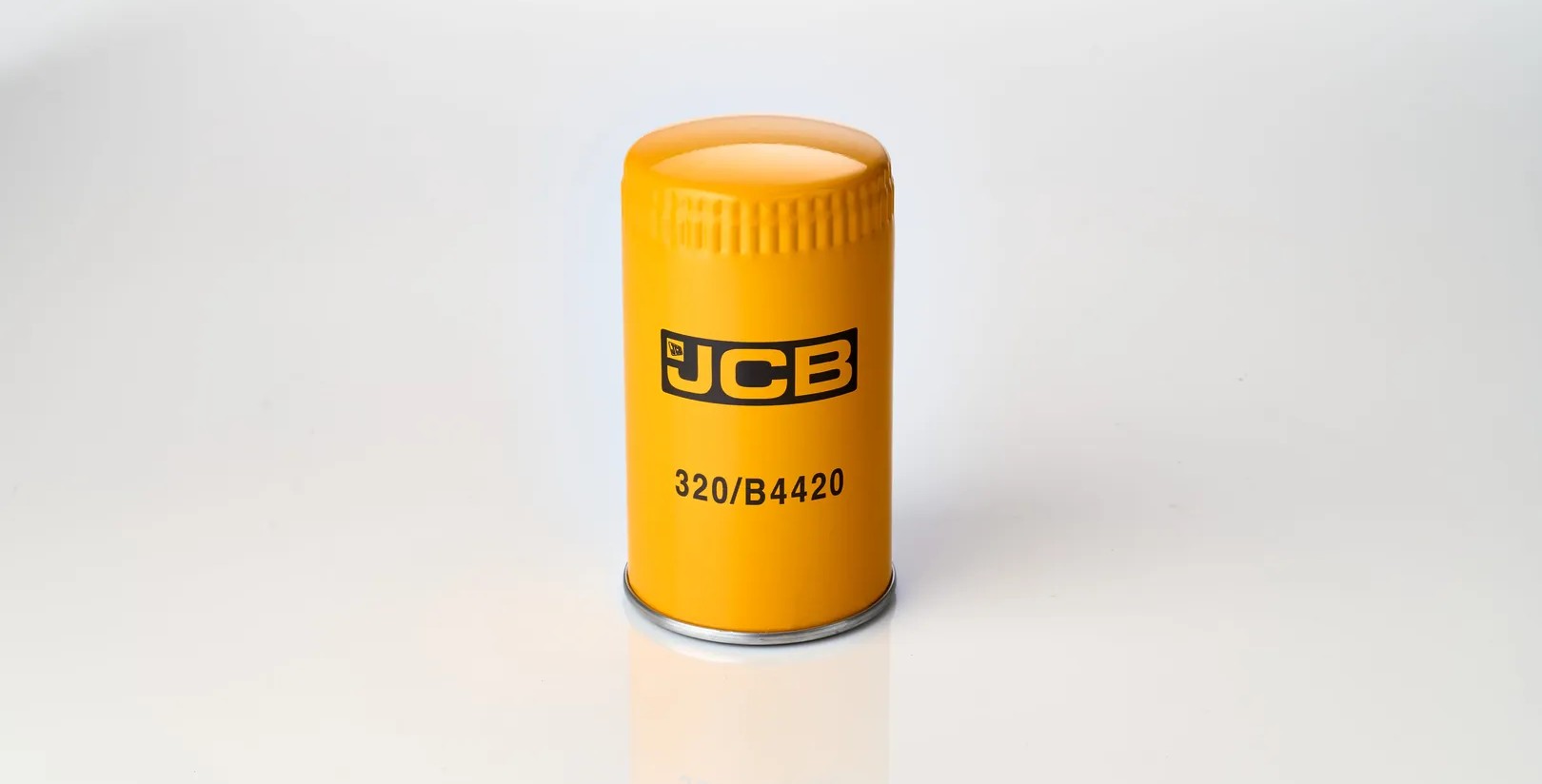 JCB oil filter 320/B4420 in yellow casing on a white background