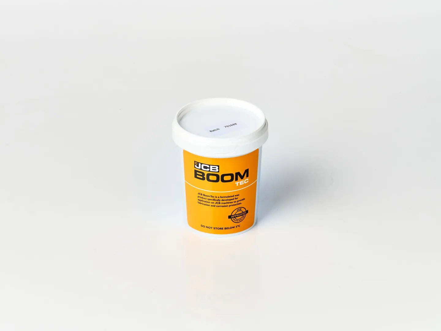 Tub of JCB Boomtec with a grey background